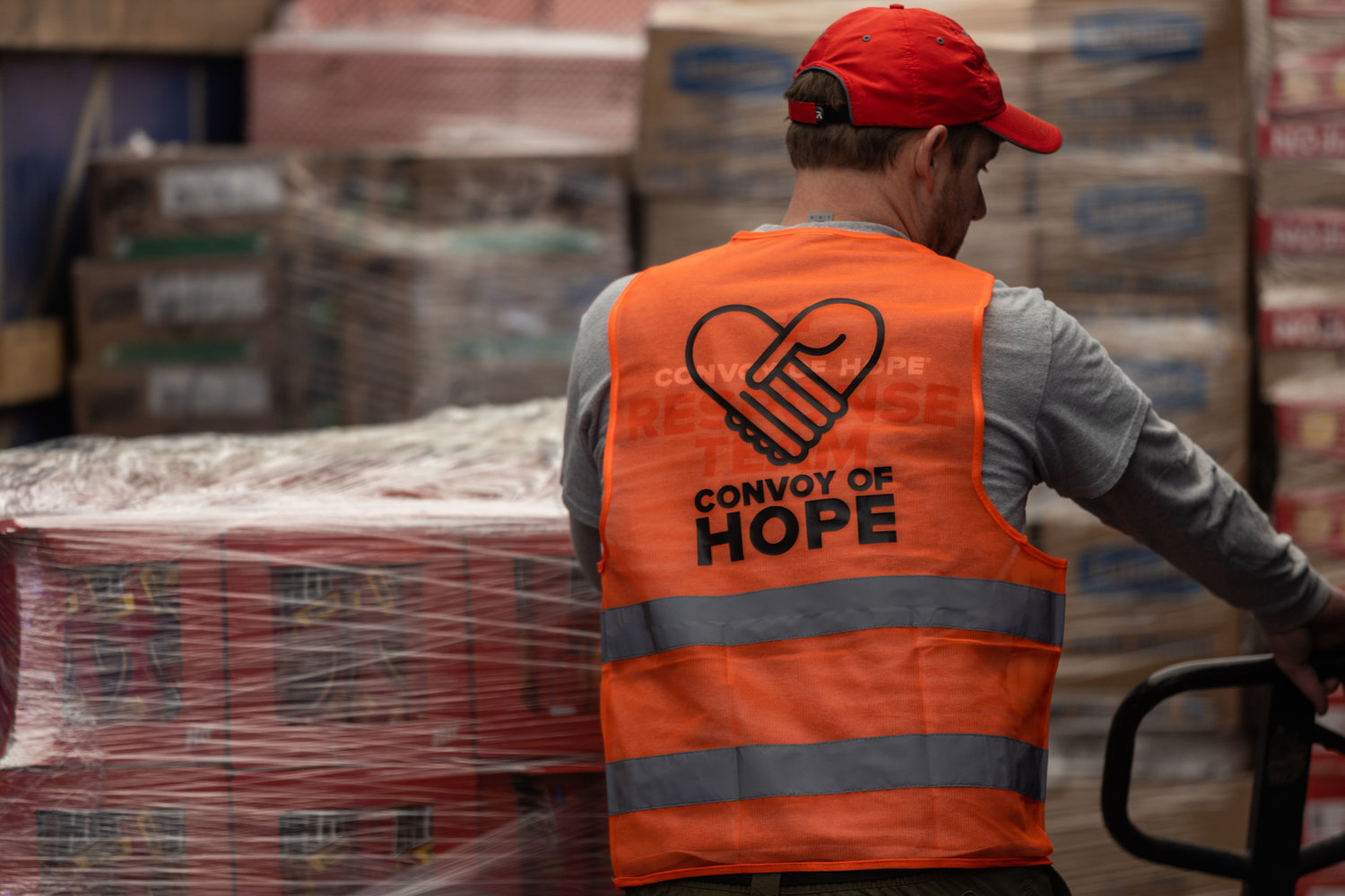 A Convoy of Hope staffer loads supplies to help Ukrainian refugees.